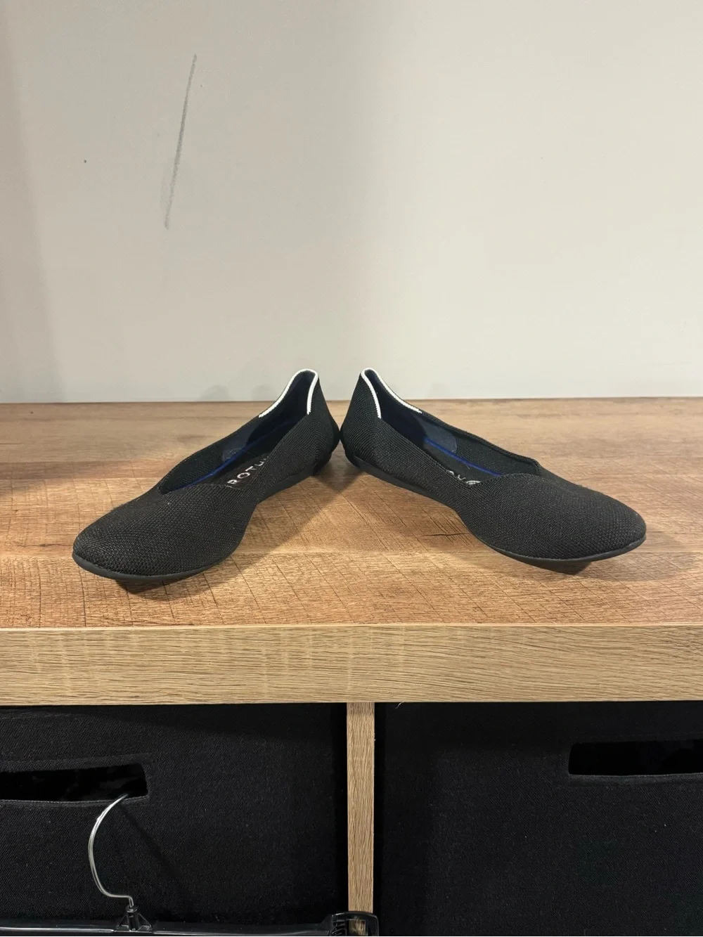 Rothy's Black Slip-On Flats with White Trim